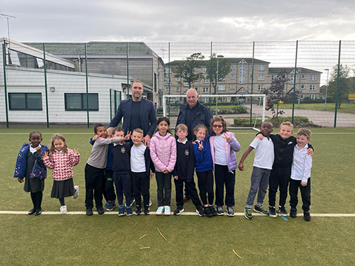 Russell and RAM Tubular Managing Director Jim Stewart pictured with pupils at Seaton Primary who attend the RAF after schools club there.
