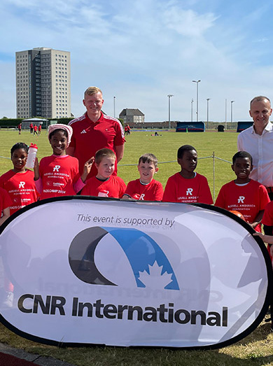 A photograph of children attending our summer camp with sponsor CNR Managing Director Barry Duncan