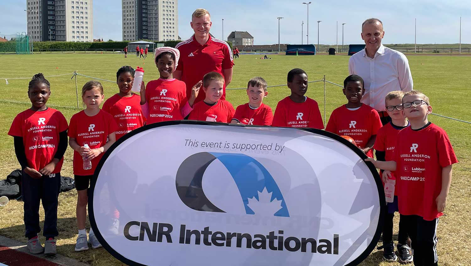 A photograph of children attending our summer camp with sponsor CNR Managing Director Barry Duncan