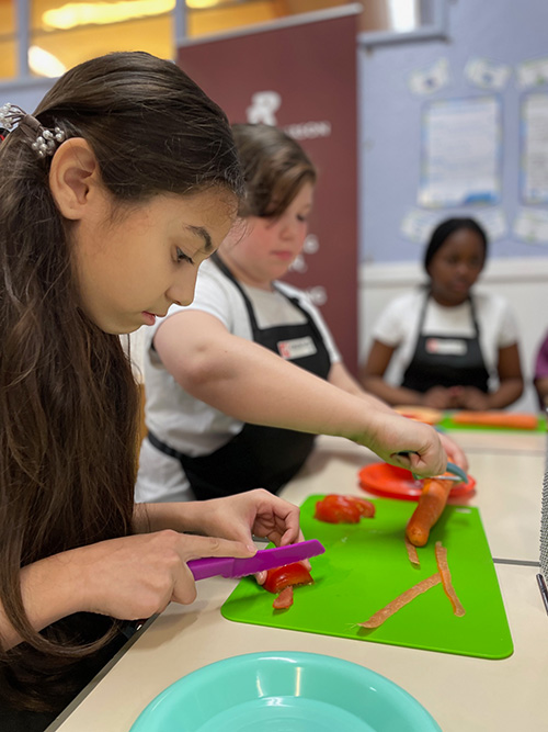 An image of a children working hard at the Russell Anderson Foundation Skills Hub